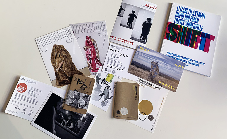 A collection of postcards and publications produced by SFAC Galleries