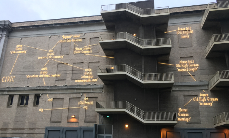 Neon words on the brick facade of the Bill Graham Auditorium