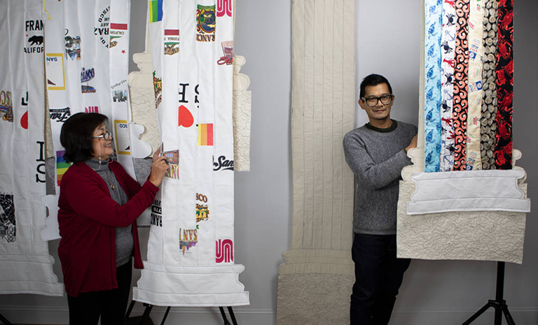 am image of the artist and his mom with the quilts they made for the exhibition Fiber Structure