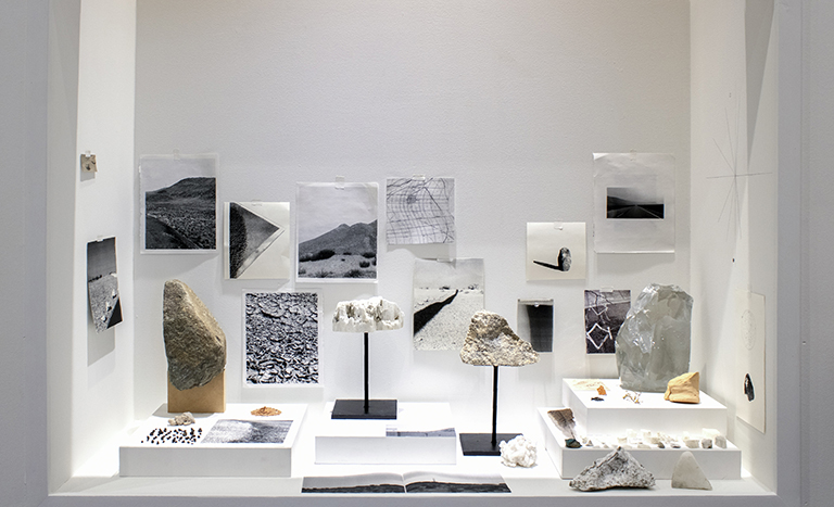 objects displayed in a case inset into the wall. 