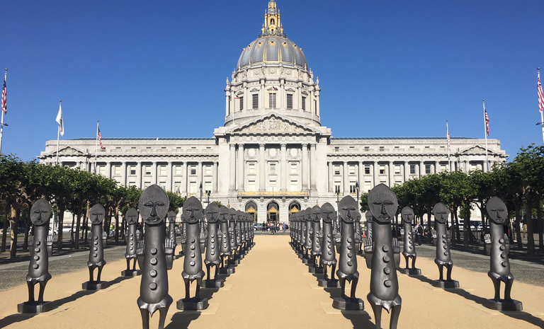 40 sculptures resembling traditional african figures in front of City Hall 