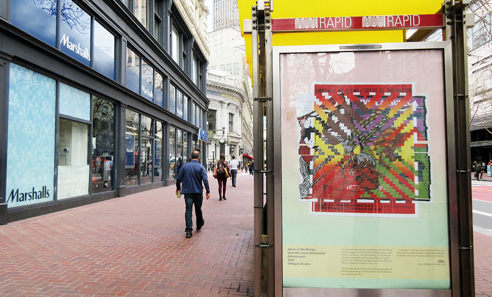 Miguel Arzabe's poster in the bus kiosk on Market Street 