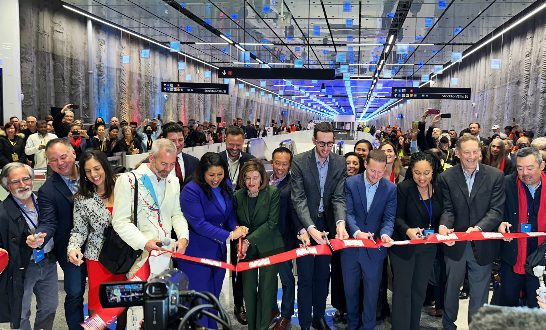 Photo of elected officials cutting a red ribbon at Union Square Market Street Station