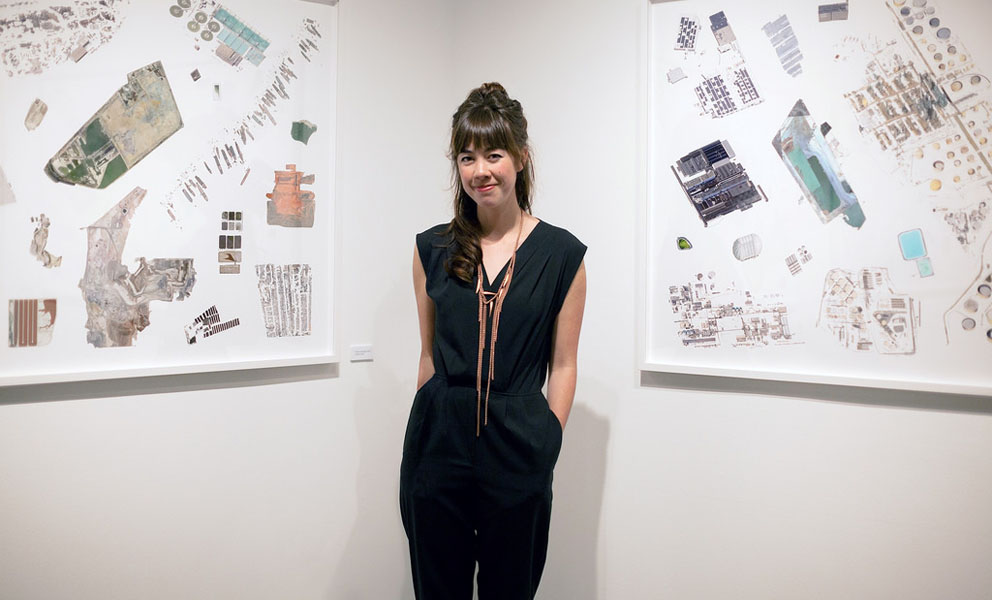 Artist Jenny Odell standing in front of her artwork.
