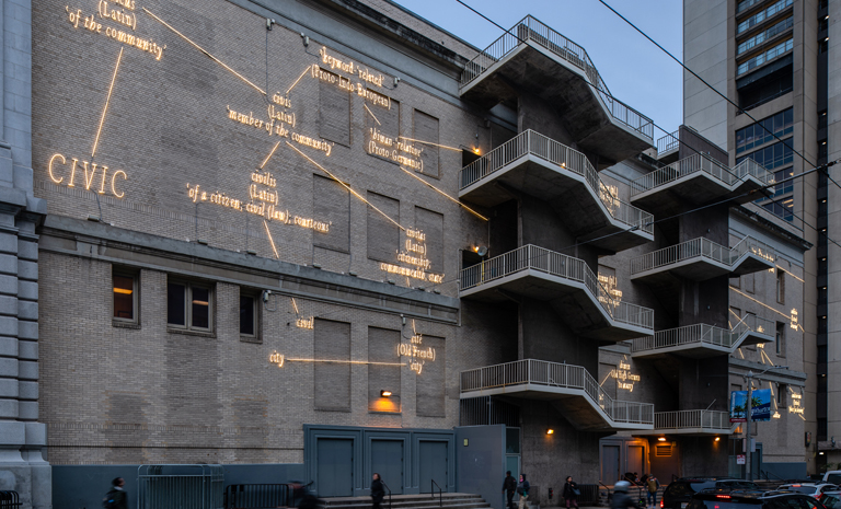 Neon words on the brick facade of the Bill Graham Auditorium